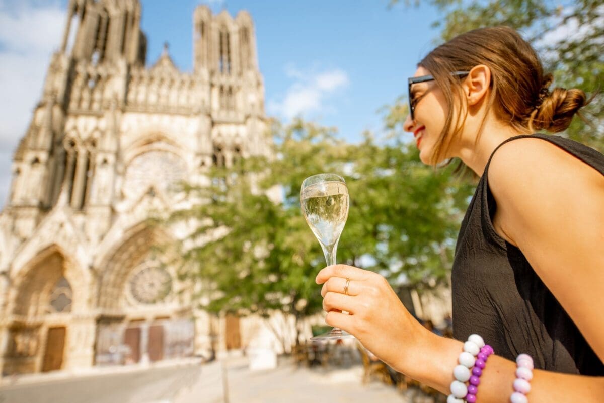 Woman with a glass of champagne in Reims, France-wine festivals in France