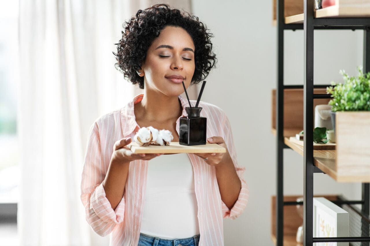 woman with aroma reed diffuser and cotton at home- Best Reed For Diffusers