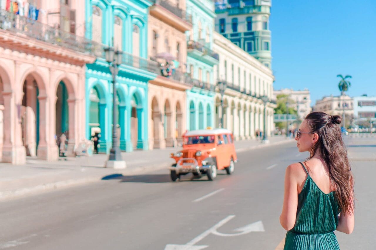 Happy woman in popular area in old Havana, Cuba.
