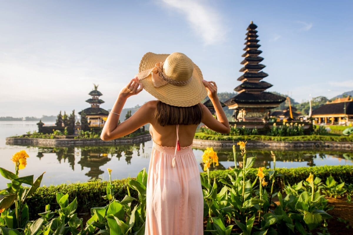 Young woman at the Pura Ulun Danu Bratan, Bali- summer vacation destinations
